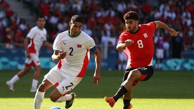 Achraf Hakimi fights for the ball with Kamal Ziad. Getty Images