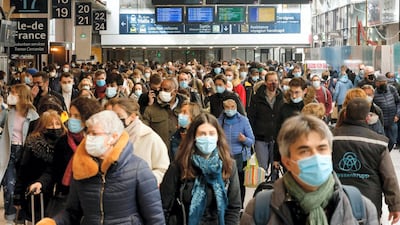 Parisians arrive to catch trains leaving from the Gare Montparnasse hours before a new lockdown in the French capital imposed to combat a surge in coronavirus infections. AFP