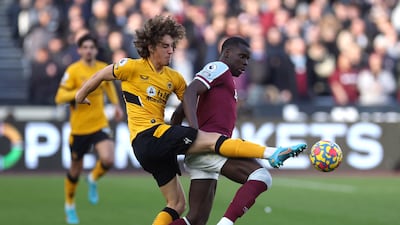 West Ham United's Kurt Zouma fights for the ball with Wolverhampton Wanderers' Fabio Silva. Reuters