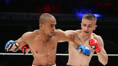 The UAE’s Ahmad Al Darmaki, in white shorts, fights with Artiyom Gorodynets from Ukraine in the Abu Dhabi Warriors 4 at IPIC Arena in Zayed Sports city in Abu Dhabi. Ravindranath K / The National