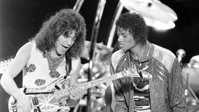 Van Halen guitarist Eddie Van Halen, left, performs 'Beat It' with Michael Jackson during Jackson's Victory Tour concert in Irving, Texas, on July 14, 1984. AP Photo