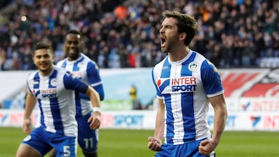 Wigan Athletic’s Will Grigg, right, celebrates scoring Wigan's second goal in a 2-0 FA Cup fourth round win over West Ham. Carl Recine / Reuters
