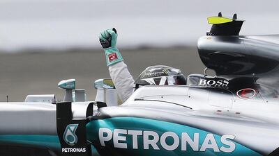 Nico Rosberg celebrates after clinching pole for the German Grand Prix. Ronald Wittek / EPA