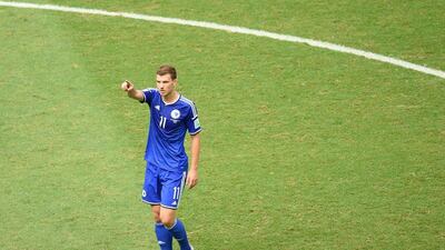 Edin Dzeko gestures to the crowd after scoring against Iran on Wednesday at the 2014 World Cup. Emmanuel Dunand / AFP / June 25, 2014