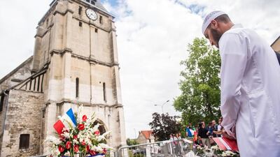 Muslim worshippers observe a minute of silence in front of the Saint Etienne church in Saint-Etienne-du-Rouvray, near Rouen, France, 29 July 2016. Four days after the hostage taking in the church of Saint Etienne du Rouvray, officials of the French Muslim community and Muslim worshippers paid tribute to the victim of the attack, priest Jacques Hamel, killed during the ISIL-linked attack on the church in Normandy. Christophe Petit / EPA