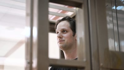 US journalist Evan Gershkovich, arrested on espionage charges, stands inside a defendants' cage before a hearing in Moscow. AFP