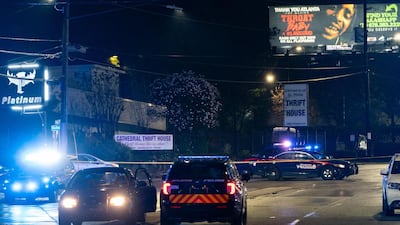 Atlanta Police vehicules are seen outside a massage parlor where a person was shot and killed in Atlanta, Georgia. Eight people were killed in shootings at three different spas in the US state of Georgia on March 16 and a 21-year-old male suspect was in custody, police and local media reported, though it was unclear if the attacks were related. AFP