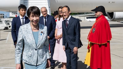 Ms Takaichi arrives at Geneva Airport. EPA