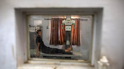 A patient inside the radiology room at Al Shifa Hospital in northern Gaza. About 4,000 of the 11,000 cancer patients in Gaza urgently require treatment abroad. EPA