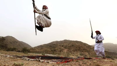 Men perform a traditional Bedouin dance in Saudi Arabia. Mohamed Al Hwaity / Reuters