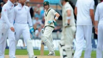 Michael Clarke, centre, was an unhappy man at the end of the fourth day's play at Old Trafford. Andrew Yates / AFP