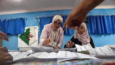 Algerian elections staff count ballots for parliamentary elections at a polling station in Bouchaoui, on the western outskirts of the capital Algiers. AFP