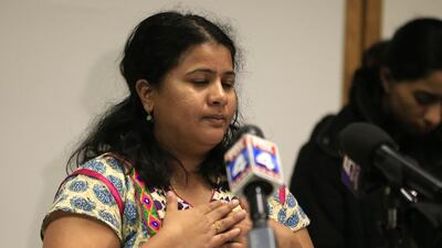 Sunayana Dumala holds her heart while talking about her late husband, Srinivas Kuchibhotla, at the Garmin headquarters in Olathe, Kansas, on February 24, 2017. Kuchibhotla was shot dead in a bar in Olathe on February 22, 2017, in an apparent racist attack. Orlin Wagner / AP Photo