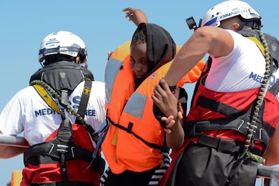 A woman is rescued by SOS Mediterranee in August during a search and rescue (SAR) operation in the Mediterranean Sea. Reuters