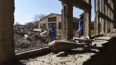 In this picture, taken on December 7, 2014, Afghan de-miners clear landmines, shells, and rockets scattered at Jangalak, south of Kabul. Shah Marai/AFP Photo
