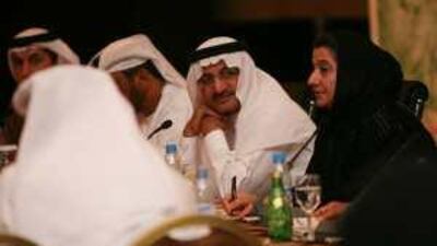 Humaid al Qattami, centre, the Minister of Education, at the meeting with parents and teachers on Wednesday.