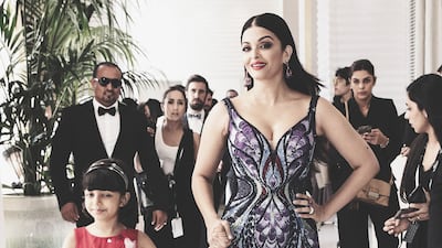 This picture shows Aishwarya and her daughter Aaradhya en route to the red carpet. Getty