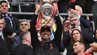 Liverpool manager Jurgen Klopp celebrates with the trophy. AFP