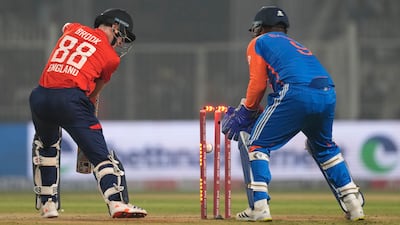 England's Harry Brook, left, is bowled by Varun Chakravarthy. AP