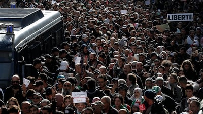 Algerian students march, one with a poster reading "Freedom", right, during a protest in Algiers. AP Photo