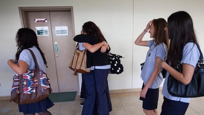 Dubai, September 11, 2011: Two students embrace at the first day of school at Dubai International Academy. ( Jaime Puebla - The National Newspaper )