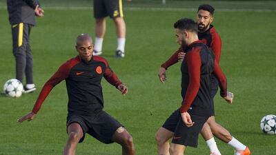 Manchester City’s Fernandinho, left, and Nicolas Otamendi, right, attend training. Peter Powell / EPA