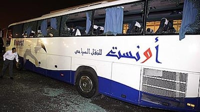 One of the damaged buses carrying the Algerian football team is seen in Cairo, Egypt, on 12 November 2009. The bus was attacked by Egyptians injuring three players.