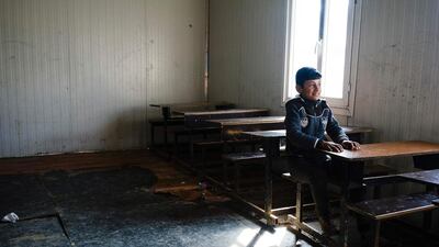 An Iraqi boy sits at a desk at a school in Mosul's eastern Gogjali neighbourhood on January 23, 2017, as scores of schools resumed their activities in the areas government forces recently recaptured from ISIL during the government's ongoing military operation against the extremists. Dimitar Dilkoff/AFP