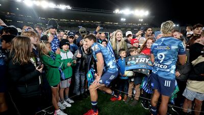Matt Duffie of the Blues signs autographs at Eden Park on Sunday. Getty