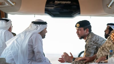 Sheikh Theyab bin Mohamed bin Zayed, Chairman of the Department of Transport, and Abu Dhabi Executive Council Member (L) and HRH Hussein bin Abdullah, Crown Prince of Jordan (R), inspect military exercise sites during the UAE and Jordan joint military drill.