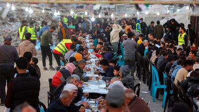 Palestinians gather for a mass fast-breaking iftar meal. AFP