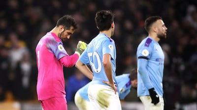 Manchester City goalkeeper Claudio Bravo (left) and team-mates look dejected. PA