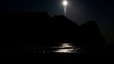 Surfer rides a wave at the Lofoten Islands in Norway on Tuesday, prior the Lofoten Masters, the most northern Surfing contest in the world, on Tuesday, September 24. AFP