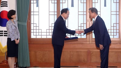 South Korean President Moon Jae-in gives a letter of credence to Lee Sok-bae, Seoul's new ambassador to Moscow. EPA