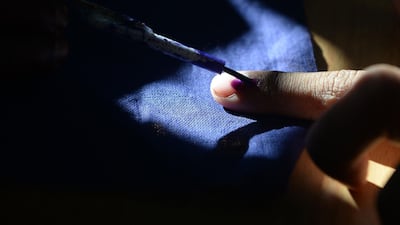 An Indian voter gets his finger marked with ink as he votes at a polling station in Chennai, during the second phase of the mammoth Indian elections. AFP