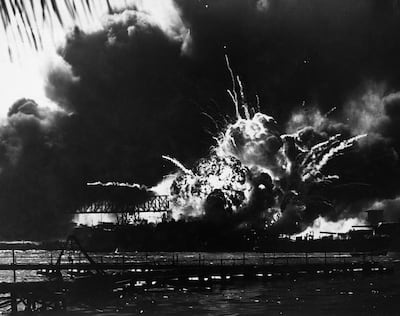 Smoke and flames as the USS Shaw explodes during the Japanese attack on Pearl Harbor in 1941. Corbis