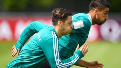 Germany's Mesut Ozil, front, has overcome a recent injury and is available for selection against Mexico, national team coach Joachim Low has said. Patrik Stollarz / AFP