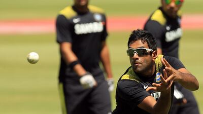 Ravichandran Ashwin takes a catch during India’s practice session at the Wanderers stadium in Johannesburg on Wednesday. The sun was beating down on them shortly after the hosts trained under cloud cover. Themba Hadebe / AP Photo