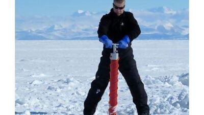 Professor Kenneth Golden takes a sample from an ice sheet in Antarctica. Courtesy of Kenneth Golden