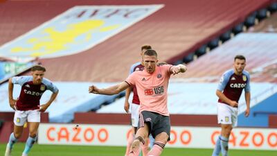 Sheffield United's English midfielder John Lundstram (C) shoots from the penalty spot but fails to score during the English Premier League football match between Aston Villa and Sheffield Utd at Villa Park in Birmingham, central England on September 21, 2020. RESTRICTED TO EDITORIAL USE. No use with unauthorized audio, video, data, fixture lists, club/league logos or 'live' services. Online in-match use limited to 120 images. An additional 40 images may be used in extra time. No video emulation. Social media in-match use limited to 120 images. An additional 40 images may be used in extra time. No use in betting publications, games or single club/league/player publications. / AFP / POOL / Julian Finney / RESTRICTED TO EDITORIAL USE. No use with unauthorized audio, video, data, fixture lists, club/league logos or 'live' services. Online in-match use limited to 120 images. An additional 40 images may be used in extra time. No video emulation. Social media in-match use limited to 120 images. An additional 40 images may be used in extra time. No use in betting publications, games or single club/league/player publications.