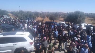 Syrian Druze religious leaders stand at the funeral of Mr Al Jaramani
