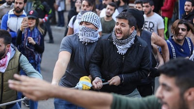 A demonstrator pulls a rope during the ongoing anti-government protest, in Beirut. Reuters