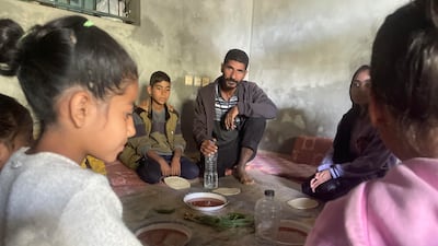 Hamad Yousef and wife Rabab, a displaced family from Gaza with their children have food through the Anera programme of community kitchens with the support of Dubai Cares. Photo: Dubai Cares