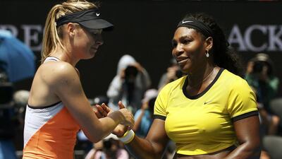 Russia's Maria Sharapova (L) reacts as she shakes hands with Serena Williams of the U.S. after Williams won their quarter-final match at the Australian Open tennis tournament at Melbourne Park, Australia, January 26, 2016. REUTERS/Tyrone Siu TPX IMAGES OF THE DAY