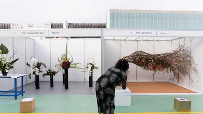 Floral arrangements at Dubai International Flower Festival. The winning work can be seen on the right of this image. Reem Mohammed / The National