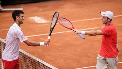 Djokovic and Koepfer after the match. EPA