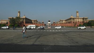 Indian government department buildings in New Delhi on September 20, top, and on November 2. AFP