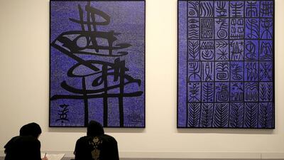 Art students sketch modern contemporary paintings at Abu Dhabi Art at Manarat Al Saadiyat. Ravindranath K / The National