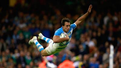 Juan Imhoff of Argentina dives over the line to score his team’s fourth try. Phil Walter / Getty Images