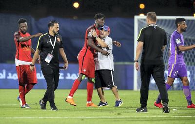 Diego Maradona embraces one of his players after the President's Cup quarter-final. Pawan Singh / The National